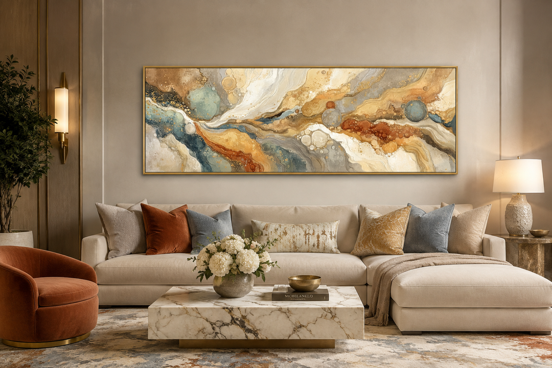 Gold and grey abstract marble canvas wall art in a horizontal frame above a neutral sofa.