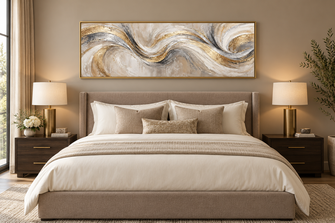 Gold and silver abstract swirl horizontal wall art framed above a bed in a neutral bedroom.