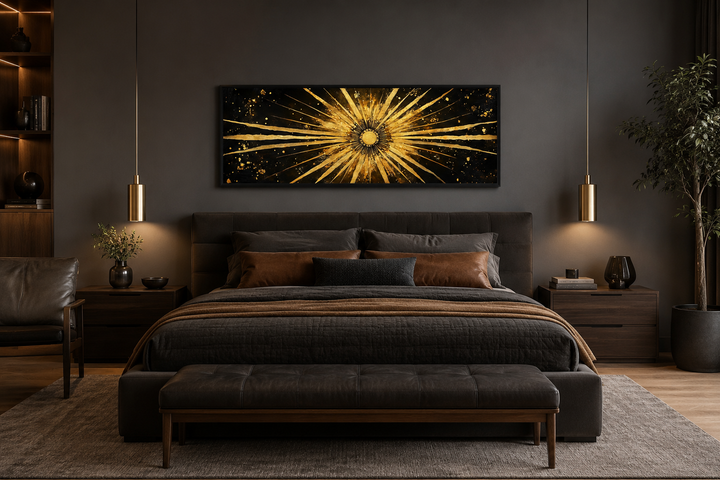 Long horizontal black and gold sunburst abstract canvas art hanging above a modern bed.