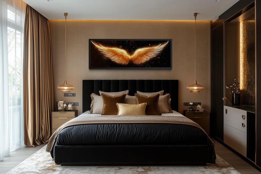 Horizontal canvas print of golden angel wings on a black background above a luxury bed.