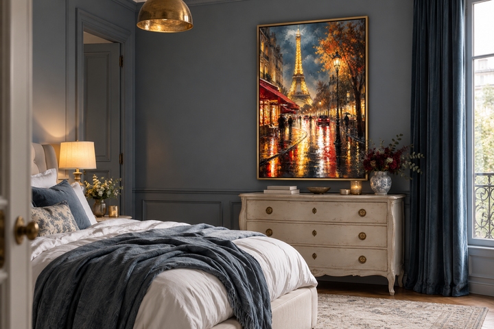 Framed oil painting of a rainy Paris street and Eiffel Tower above a vintage dresser in a bedroom.