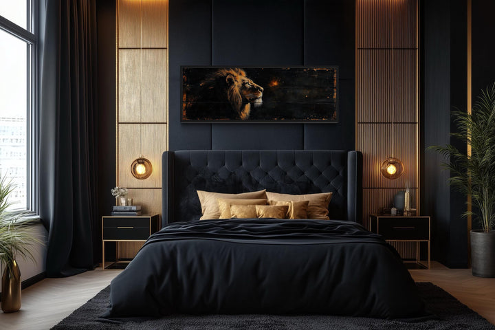 Golden lion horizontal canvas wall art centered above a black tufted bed in a modern bedroom.