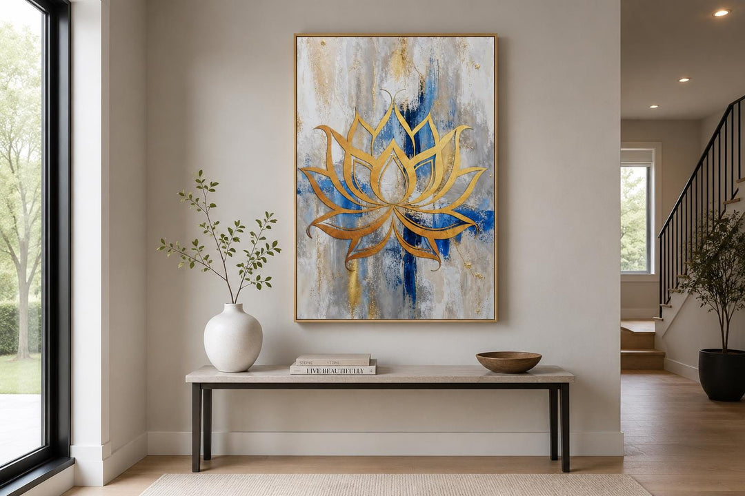 Golden lotus flower outline on abstract blue, gray, and gold background canvas wall art.