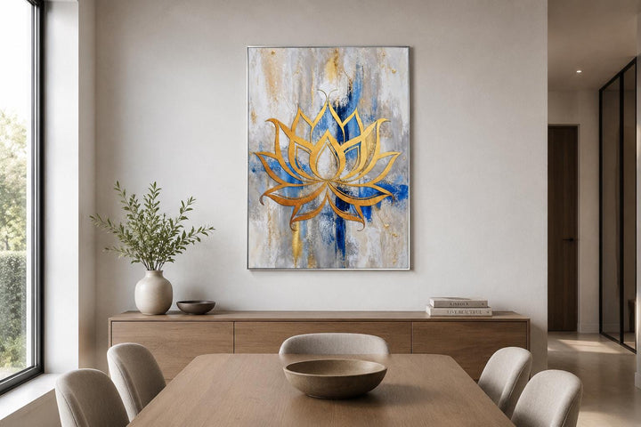Golden lotus flower outline on an abstract blue, gray, and gold background canvas wall art.