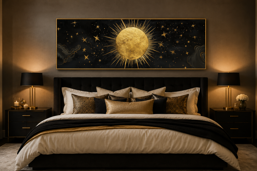 Golden sun and stars black gold long horizontal canvas wall art hanging above a bed.