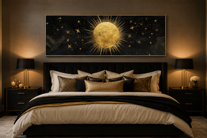Golden sun and stars black gold long horizontal canvas wall art hanging above a bed.