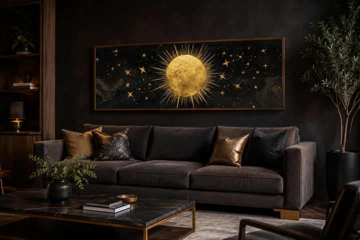 Golden sun and stars horizontal canvas wall art above a dark sofa in a modern living room.
