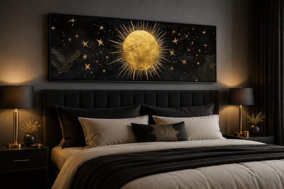 Golden sun and stars black gold long horizontal canvas wall art hanging above a bed.