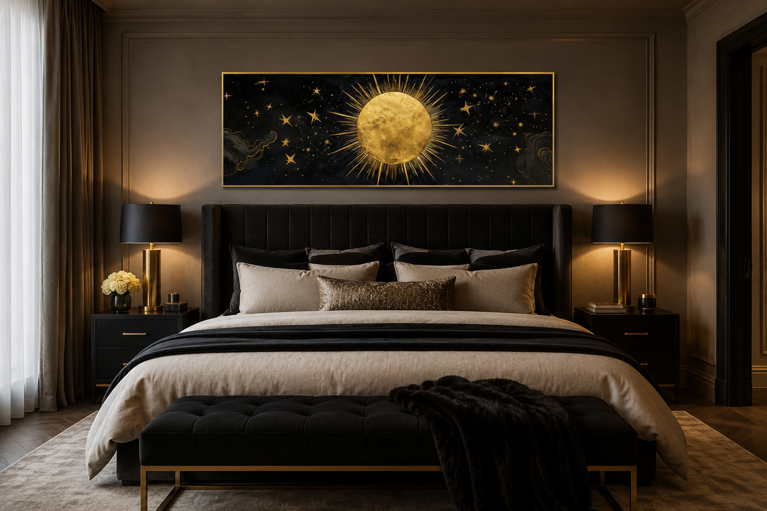 Golden sun and stars black gold long horizontal canvas wall art hanging above a bed in a bedroom.