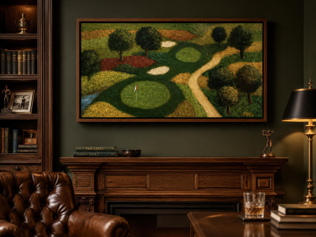 Golf course aerial view canvas wall art in a dark-paneled home office above a wooden fireplace.