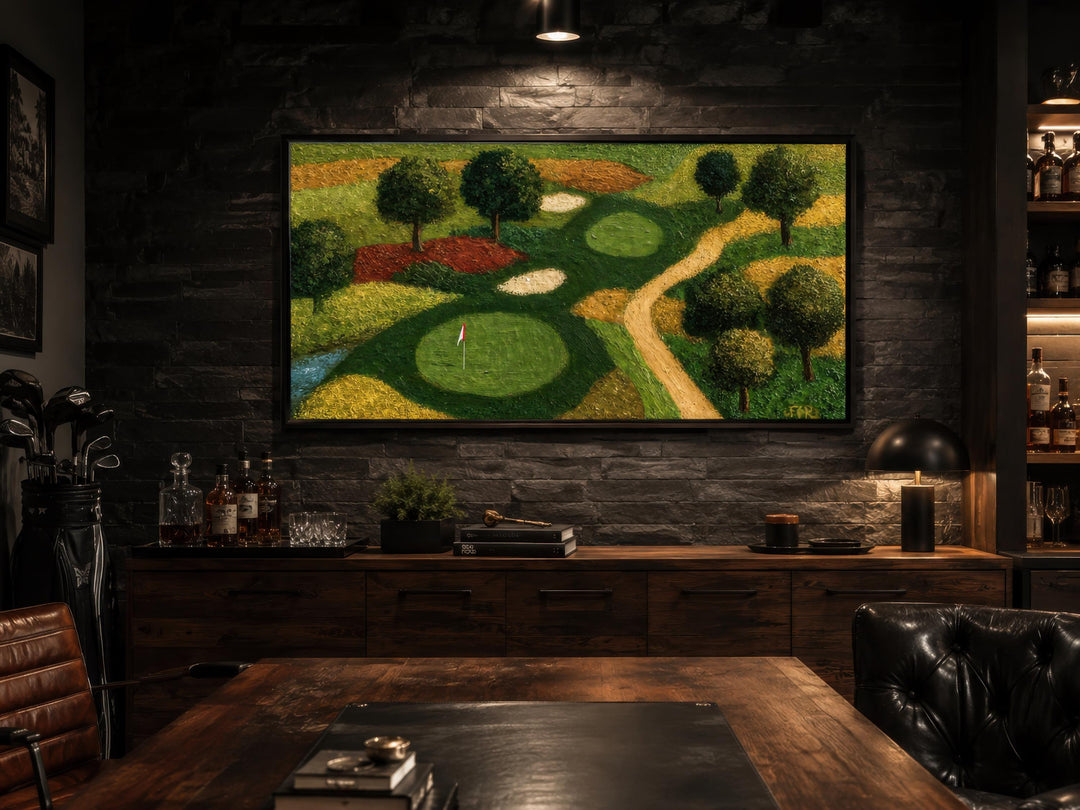 Aerial view golf course canvas wall art in a dark-toned man cave with leather and wood accents.