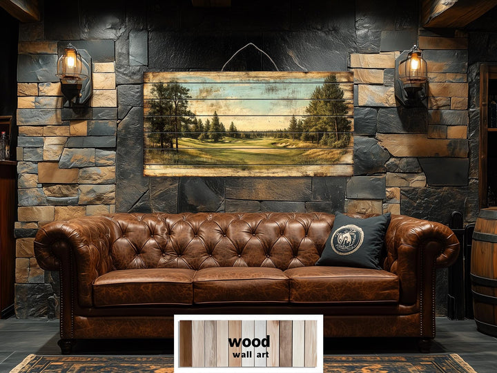 Golf course landscape printed on distressed wood planks hanging above a brown leather sofa.