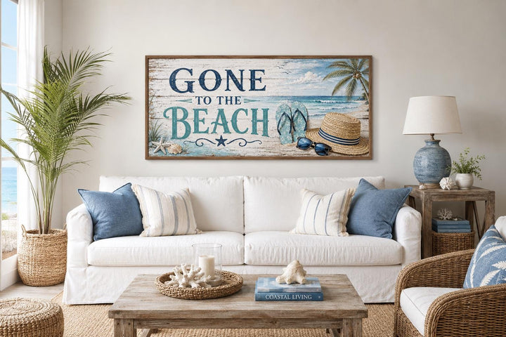 Gone To The Beach Sign horizontal canvas print above a white sofa in a coastal living room.