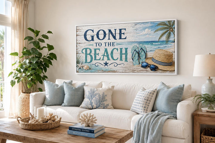 Gone To The Beach horizontal canvas print hanging above a white sofa with coastal decor.