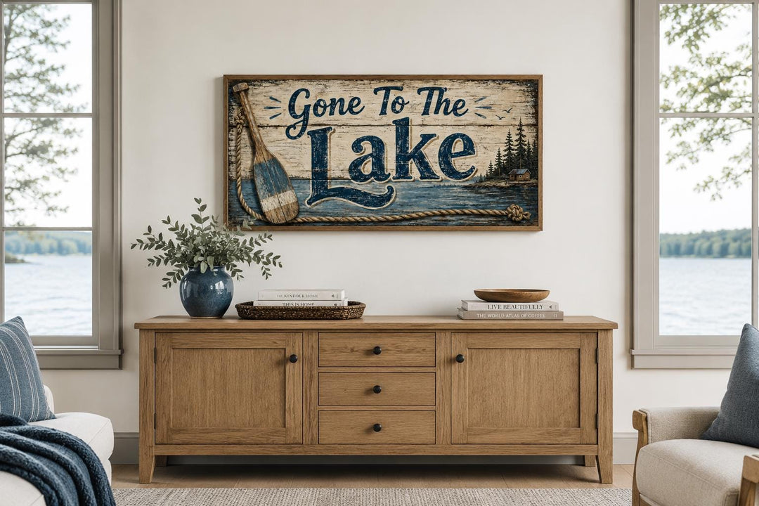 Gone To The Lake canvas wall art with navy lettering and an oar on a rustic wood-style background.
