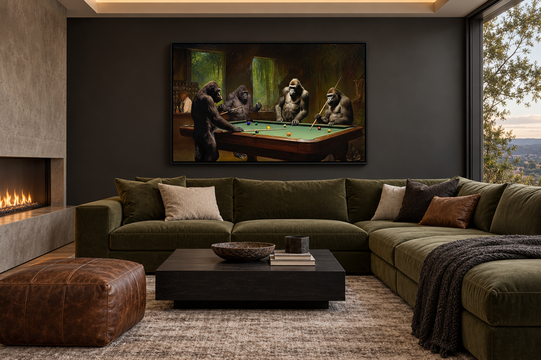 Framed canvas wall art of gorillas playing billiards in a modern living room above a green sofa.