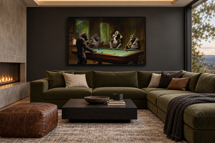 Framed canvas wall art of gorillas playing billiards in a modern living room above a green sofa.