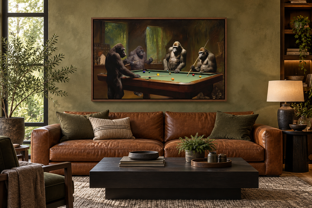Gorillas playing billiards framed canvas wall art above a leather sofa in a man cave lounge.