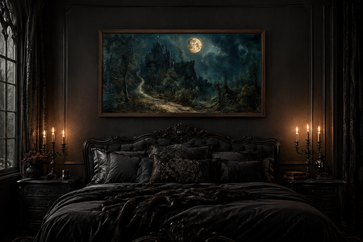 Framed canvas of a gothic castle under a full moon hanging above a dark, ornate bed with candles.