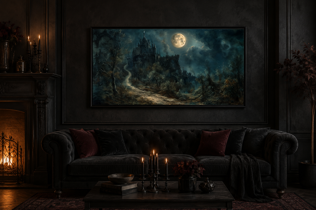 Framed gothic painting of a haunted castle under a full moon in a dark, moody living room.