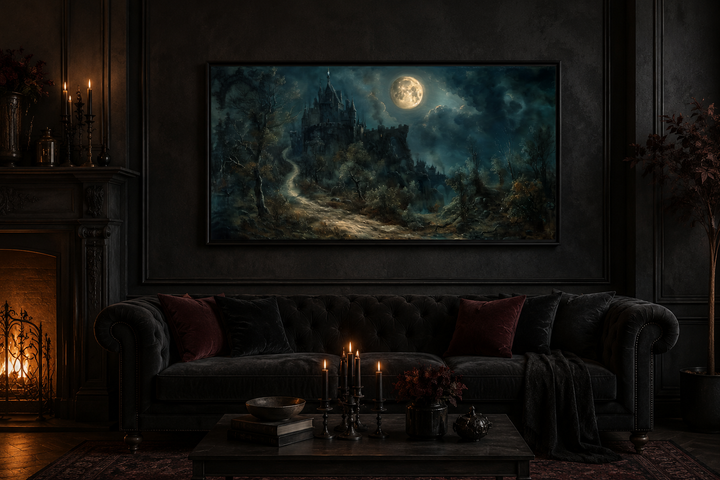Framed gothic painting of a haunted castle under a full moon in a dark, moody living room.