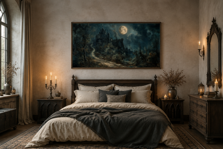 Framed gothic artwork of a haunted castle under a full moon hanging above a bed in a dark bedroom.
