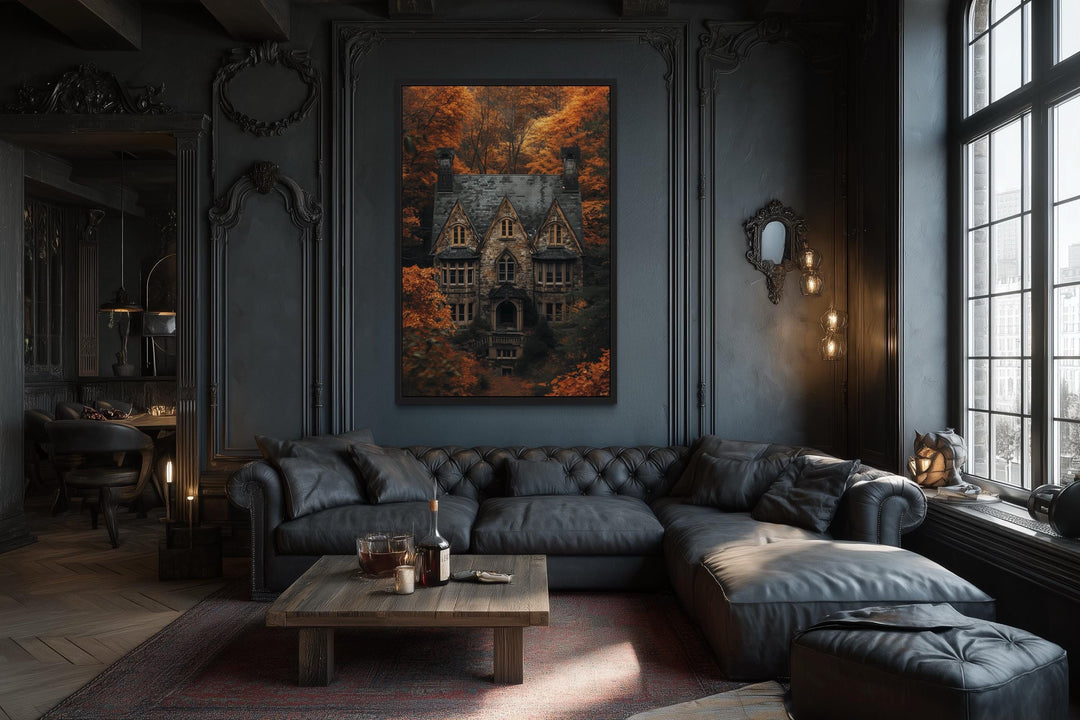 Gothic haunted house canvas art in a dark academia living room with a black leather sofa.