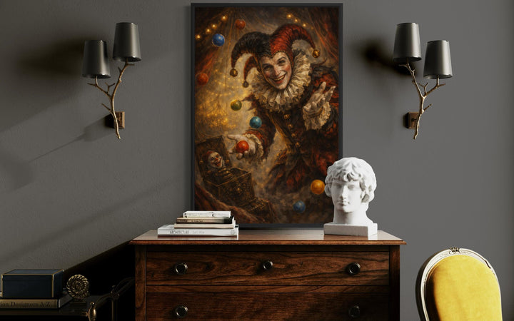 Gothic jester canvas print in a black frame, styled on a dark wall between two branch-like sconces.