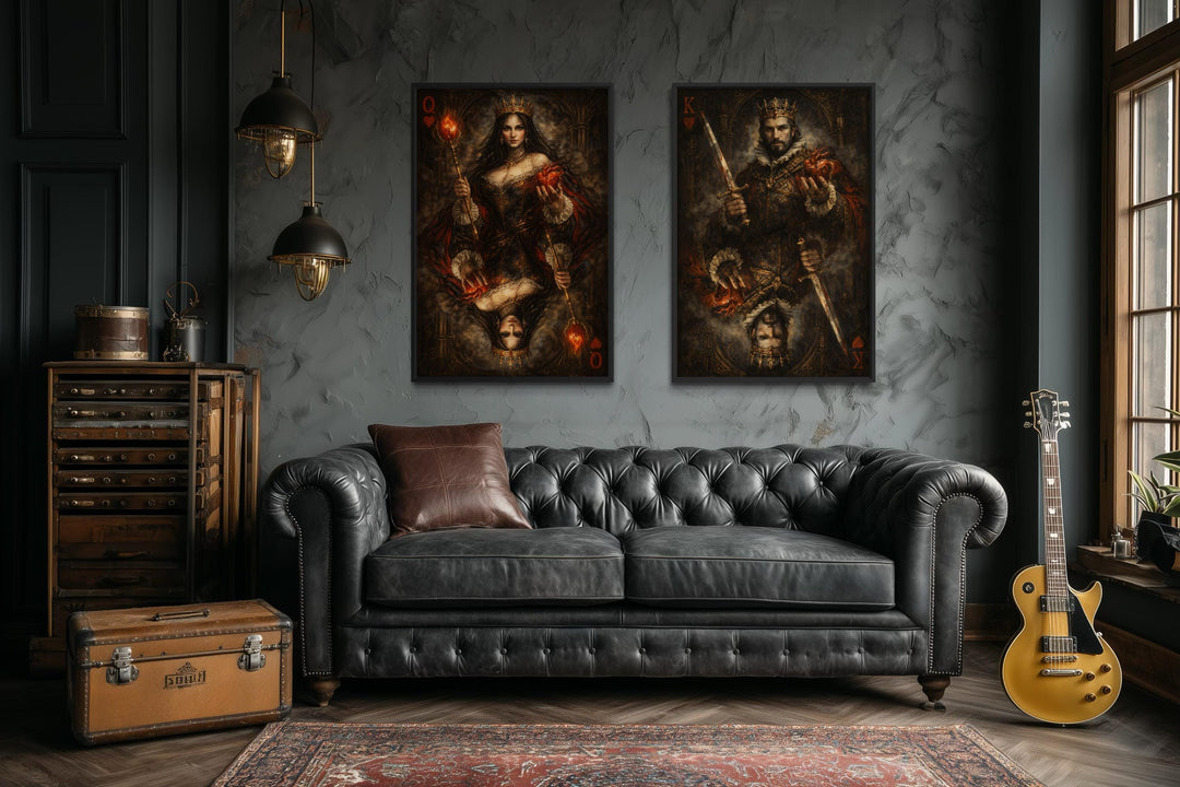 A set of two gothic canvas prints featuring a king and queen of hearts above a black leather sofa.