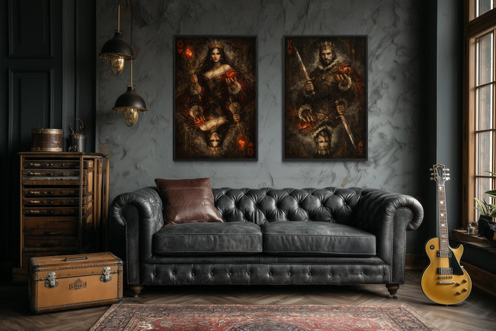 A set of two gothic canvas prints featuring a king and queen of hearts above a black leather sofa.