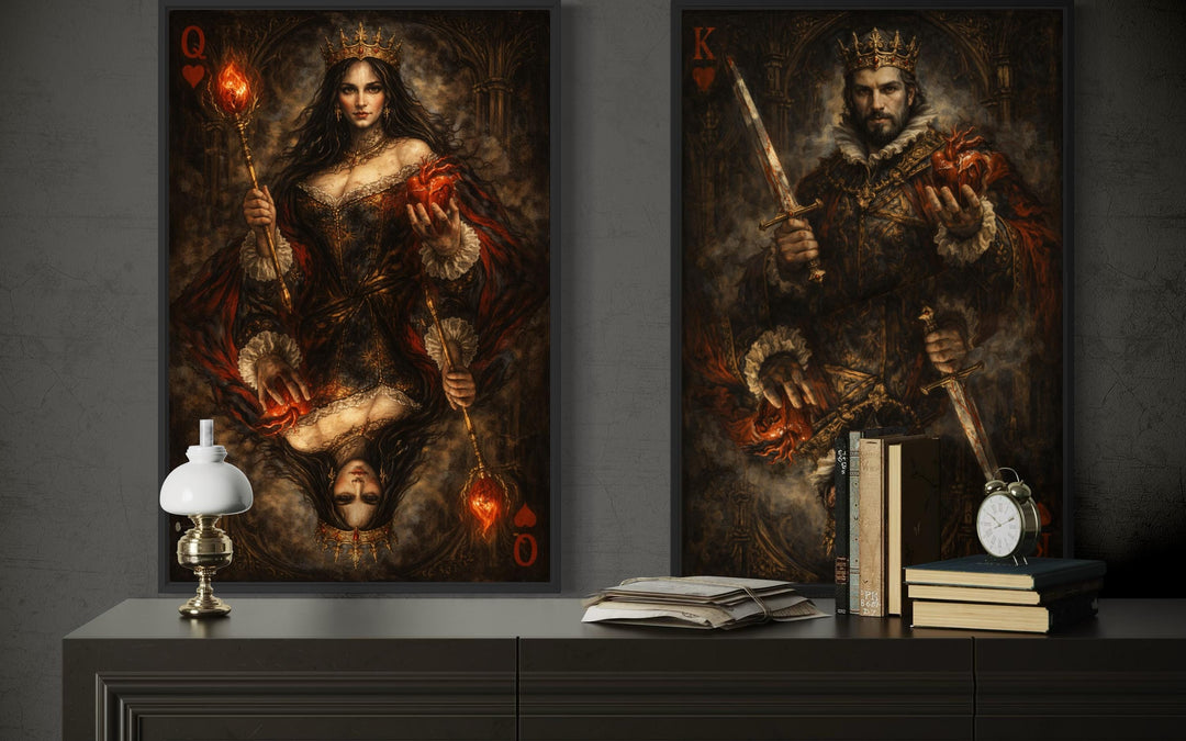 Two gothic-style canvas prints of a king and queen of hearts displayed on a dark wall.