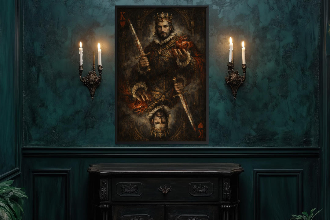 Gothic King of Hearts canvas print in a dark frame on a teal wall between two candle sconces.