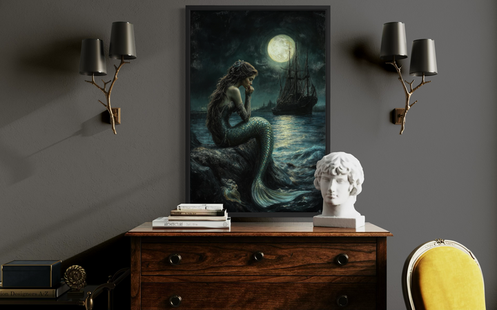 Gothic mermaid wall art featuring a dark ocean, full moon, and pirate ship above a wooden dresser.
