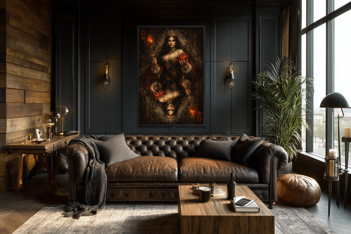 Gothic Queen of Hearts canvas print displayed in a dark, moody living room above a leather sofa.