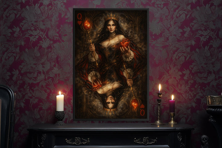 Gothic Queen of Hearts canvas print in a black frame on a dark mantel with candles.