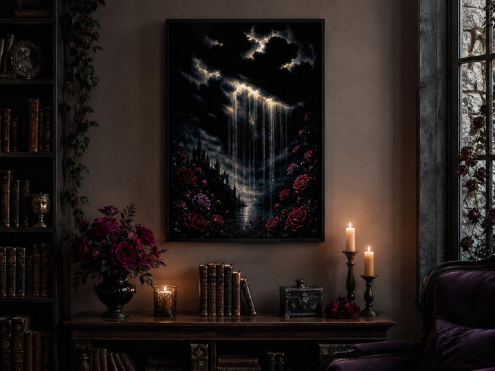 Gothic wall art of a crying cloud over a castle with red roses in a moody, candlelit room.