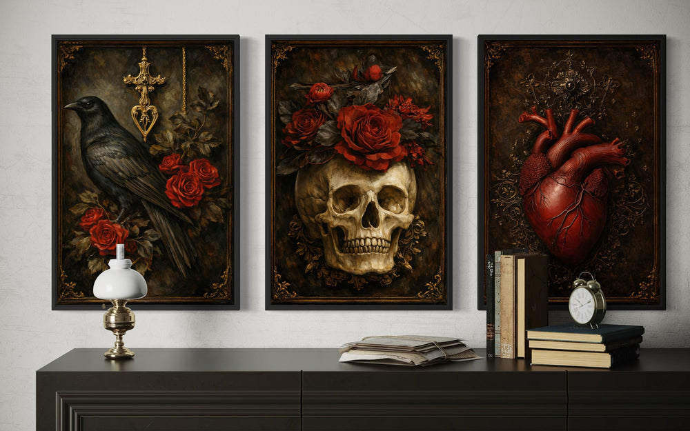 Gothic wall art triptych featuring a raven, a skull with roses, and an anatomical heart.