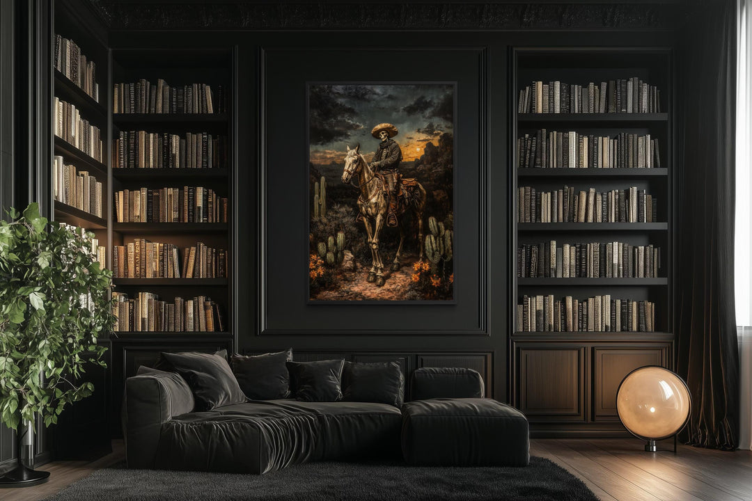 A framed canvas of a skeleton cowboy on a horse in a dark, gothic library with black bookshelves.