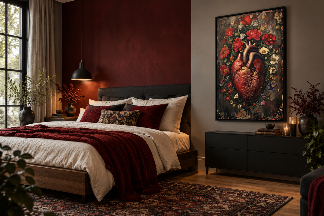 Gothic human heart and flowers framed wall art in a moody bedroom with dark red and grey walls.