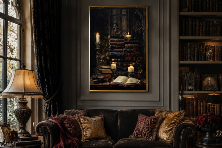 Gothic wall art of vintage books and glowing candles in a gold frame above a dark velvet sofa.