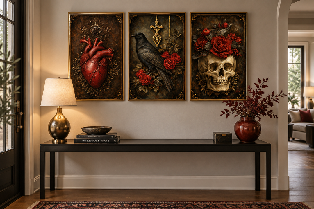 Gothic Wall Art Set of 3 featuring a raven, skull with roses, and anatomical heart in gold frames.