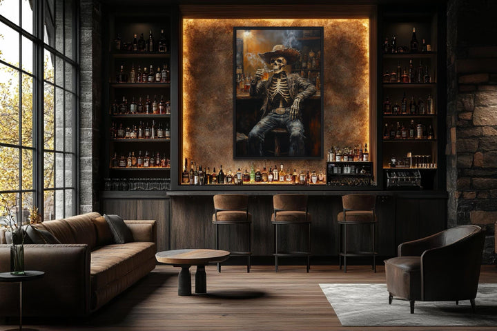 Graffiti skeleton cowboy wall art in a dark bar setting above a modern home bar with stools.