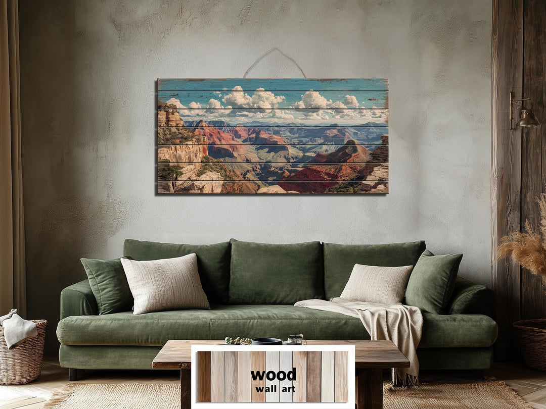 Grand Canyon landscape printed on horizontal distressed wood planks hanging above a green sofa.