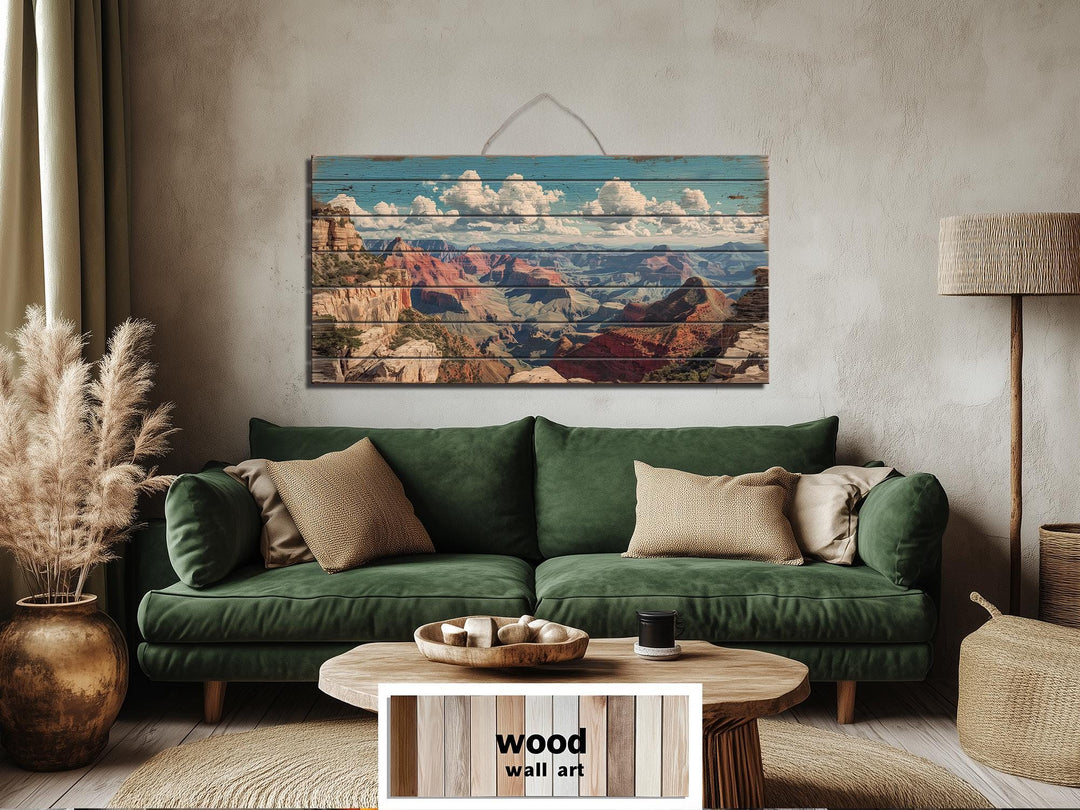 Grand Canyon landscape printed on horizontal distressed wood planks hanging above a green sofa.