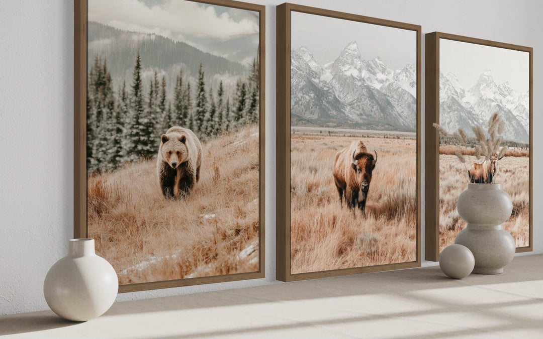 Set of 3 vertical wildlife prints featuring a bear, bison, and moose in neutral-toned landscapes.