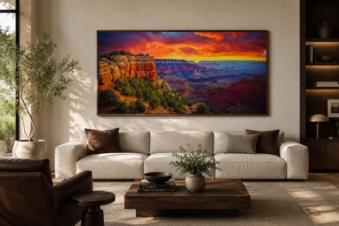 Framed Grand Canyon sunset canvas print above a cream sofa in a modern living room.
