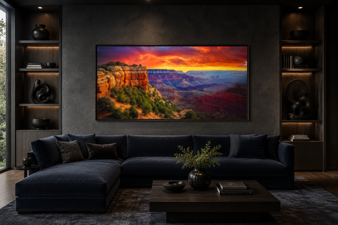 Framed Grand Canyon sunset canvas wall art above a navy blue sectional sofa in a modern living room.