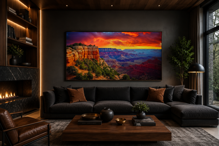 Framed Grand Canyon sunset canvas print above a dark sofa in a modern living room.