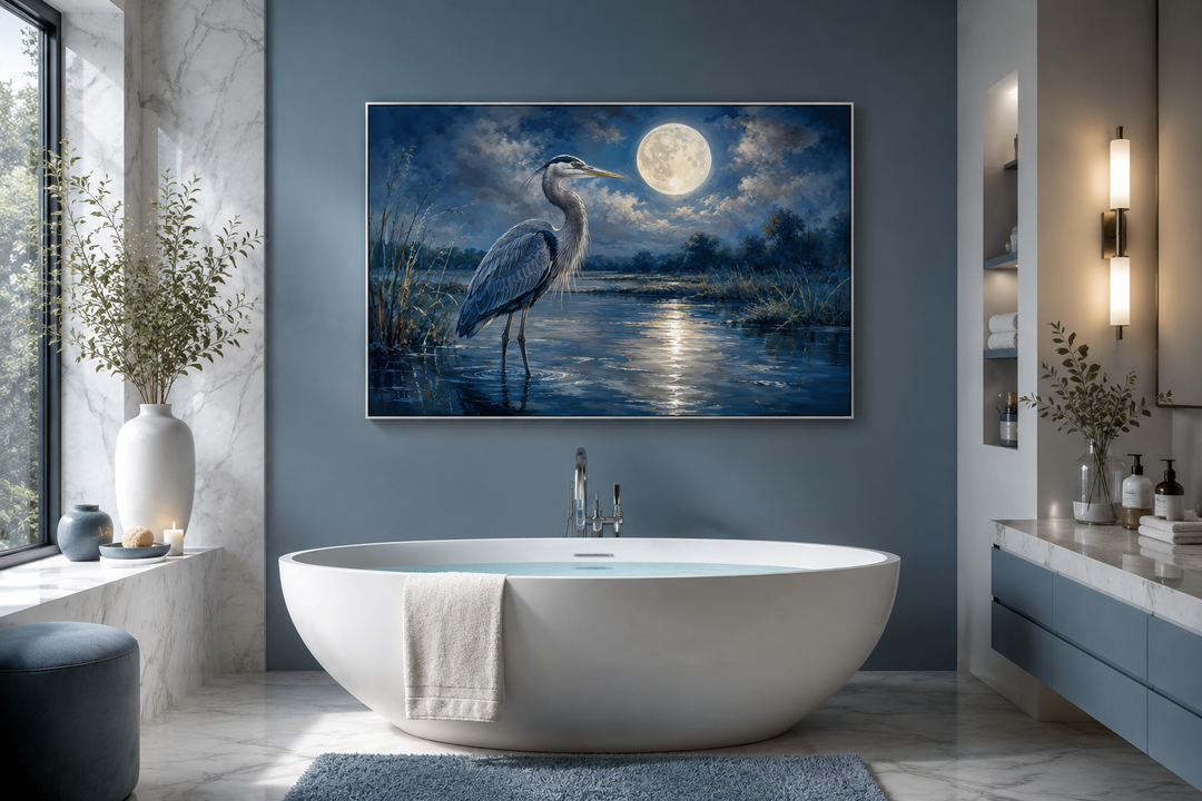 Great Blue Heron and full moon at night framed canvas wall art hanging in a modern bathroom.