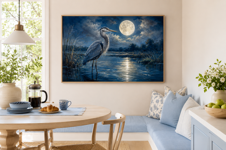 Great Blue Heron and full moon at night framed canvas wall art in a coastal dining nook.